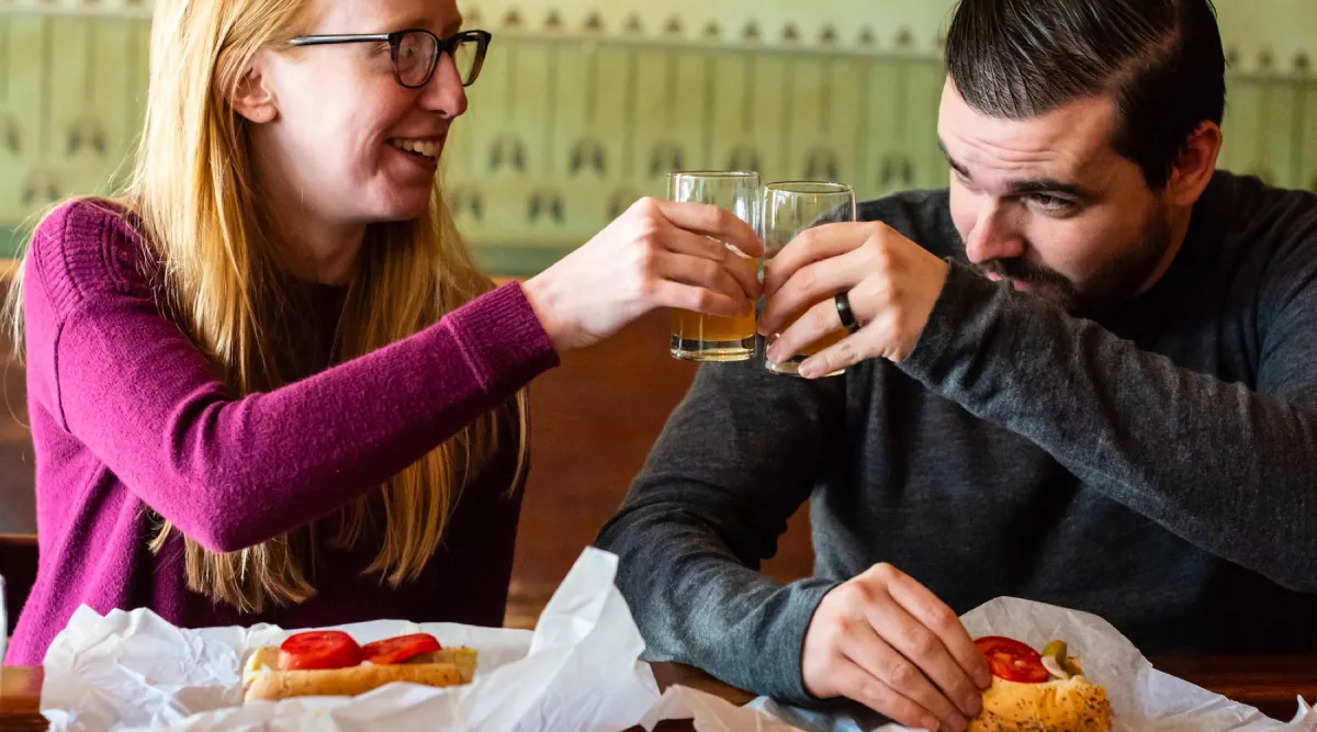 Guests on a food tour tasting at a local restaurant stop