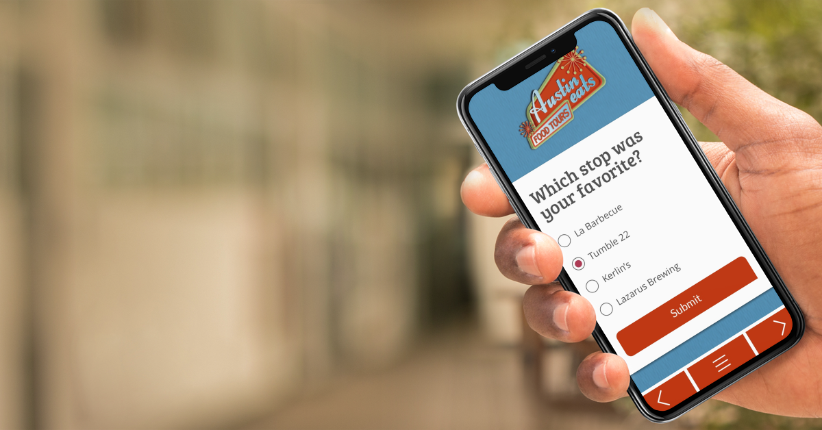 Man holding a phone with a digital guidebook